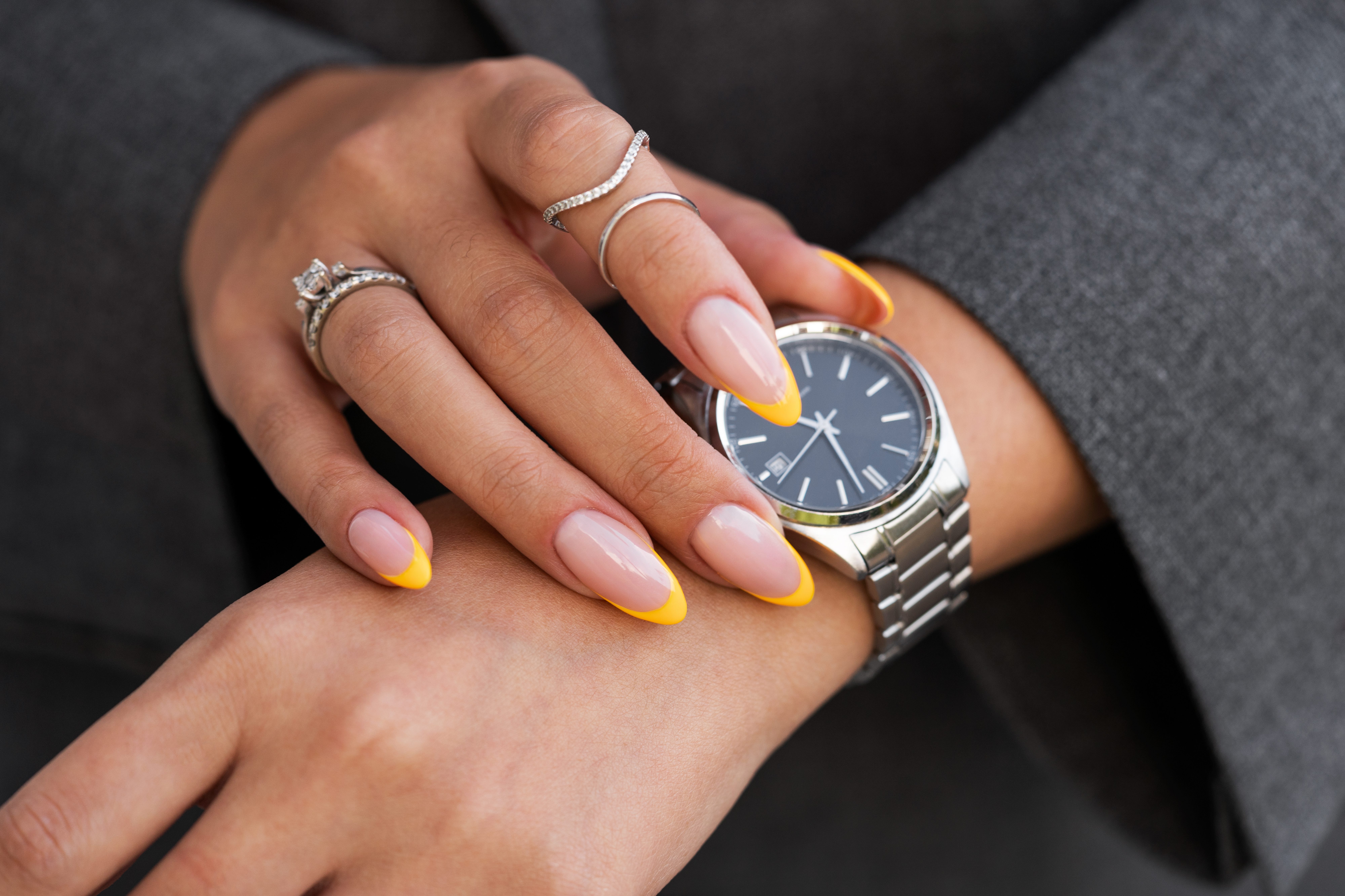 woman-showing-her-nail-art-fingernails-with-watch